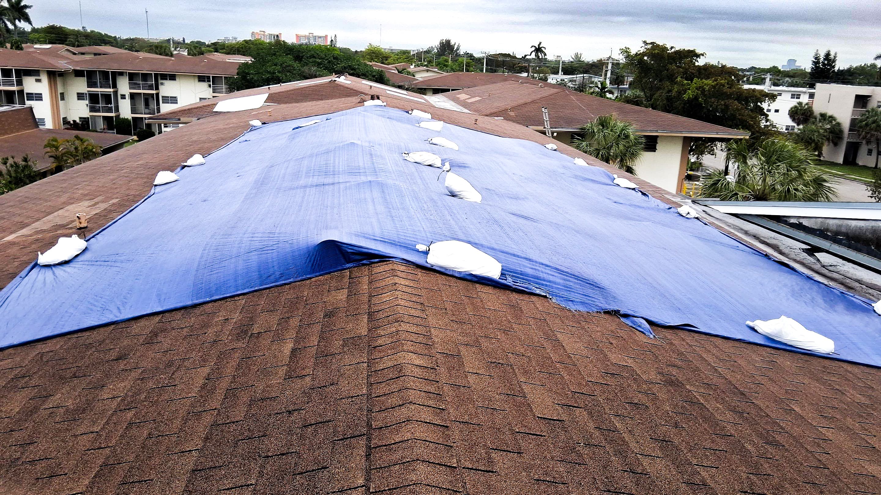 Emergency roof tarping after hurricane damage in Miami — 24/7 storm response by T&S Roofing Systems